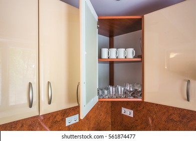 Dishes In The Upper Cupboard In The Kitchen