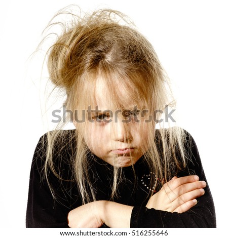 Disheveled preschooler girl with stupid face, isolated on white background