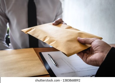 Dishonest cheating in business illegal money, Businessman receive bribe money in envelope to business people to give success the deal contract of investment, Bribery and corruption concept. - Shutterstock ID 1383868892