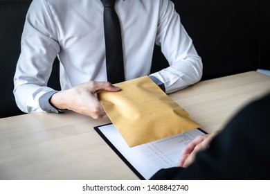 Dishonest cheating in business illegal money, Businessman receive bribe money in envelope to business people to give success the deal contract of investment, Bribery and corruption concept. - Shutterstock ID 1408842740