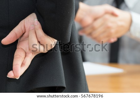 Dishonesty, Business fraud concept, Businessman showing fingers crossed