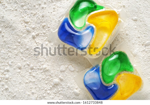 Dishwasher detergent tablets and powder. Choice\
concept. Copy space