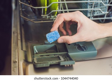 Dishwasher With Dirty Dishes. Powder, Dishwashing Tablet And Rinse Aid. Washing Dishes In The Kitchen