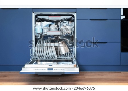 Dishwasher in modern kitchen. Perfectly washing dishes