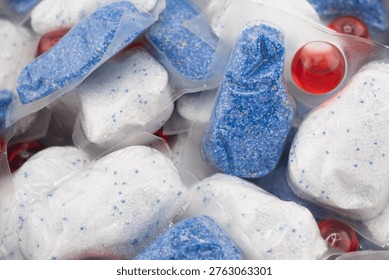 Dishwasher tablet texture background. Macro shot.Dishwasher detergent tablets. Tablets for cleaning dishes Detergent or cleaning agent.