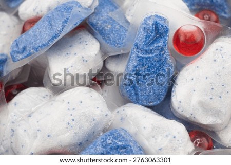 Dishwasher tablet texture background. Macro shot.Dishwasher detergent tablets. Tablets for cleaning dishes Detergent or cleaning agent.