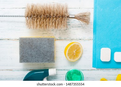 Dishwashing Products On White Wood Table