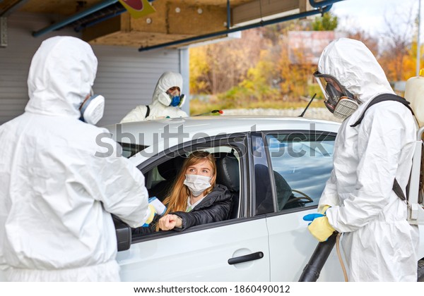 disinfectant check\
body temperature of woman in car screening using thermometer,\
prevent people from\
fever,Coronavirus