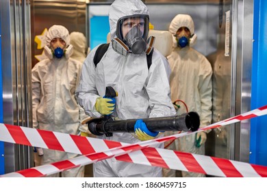 Disinfectants Are Cleaning Inside The Building In Quarantine Zone. COVID-19 , In Suits