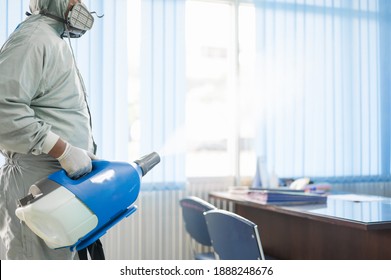 Disinfecting Of Office To Prevent COVID-19, Person In White Hazmat Suit With Disinfect In Office, Coronavirus Healthcare System Concept