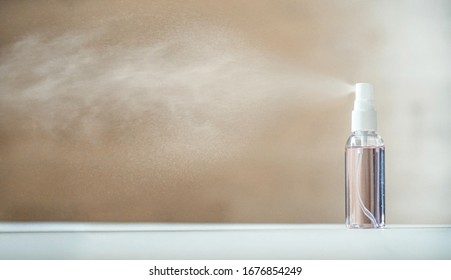 Disinfecting sanitizer bottle alcohol spray diffusing antibacterial sanitiser preventing spread of germs, bacterias, viruses on table. Personal hygiene, disinfection, coronavirus protection concept. - Powered by Shutterstock