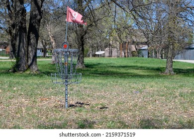 A Disk Golf Basket In The Park 