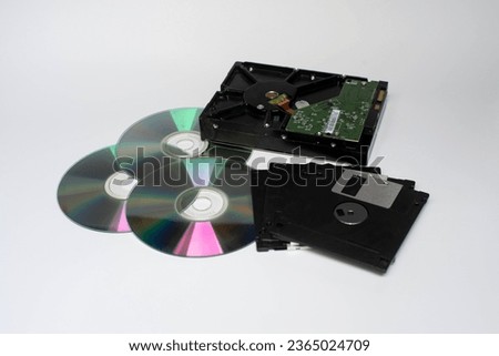 diskette, CD, hard disk, storage device On a white background. “SHOTLIST1990