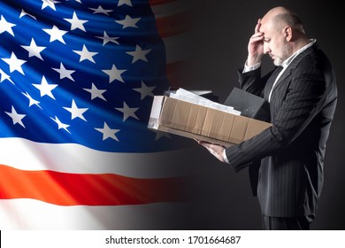 The Dismissed Employee Clutched His Head Against The Background Of The US Flag. Unemployment In America. Job Cuts In The United States. Loss Of Livelihood. Deterioration Of People's Lives.