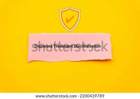 Disparate Treatment Discrimination.The word is written on a slip of colored paper. Insurance terms, health care words, Life insurance terminology. business Buzzwords.