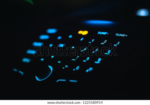 Display of audio\
system panel with media, phone, sound, radio and menu buttons.\
Modern car control panel with radio control and dial pad.  Control\
panel of a transport van.\
