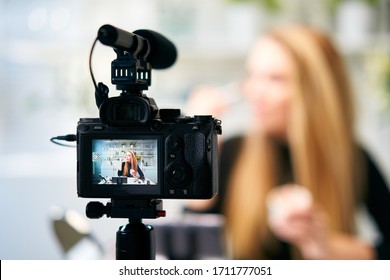 Display of camera recording video blog for blonde beauty blogger woman with make-up at home studio. Influencer vlogger girl live streaming cosmetics masterclass. Online learning and marketing concept. - Shutterstock ID 1711777051