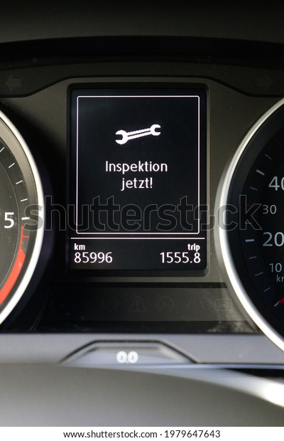 display in a car cockpit with german words\
Inspektion jetzt, translation service\
now