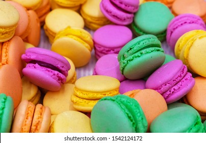 Display Case With A Colorful Variety Of Parisian Macaron Cookies.