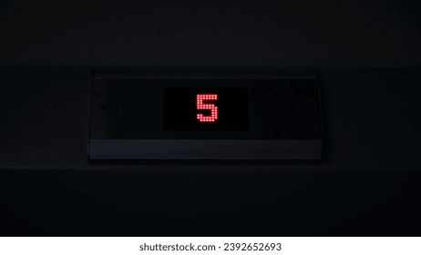 Display of an elevator going down indicating the floor number passing. Concept. LED screen, interior.