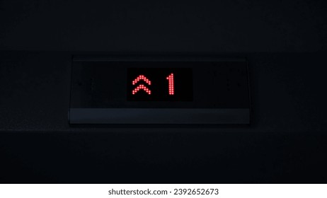 Display of an elevator going up indicating the floor number passing with red arrows. Concept. LED screen, interior. - Powered by Shutterstock