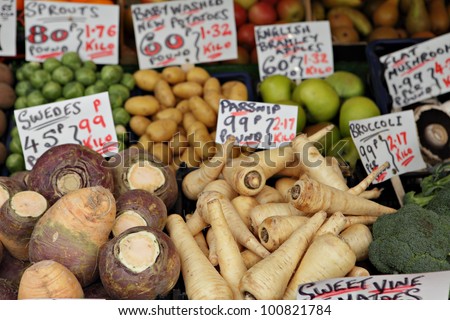 A display of late season vegetables on a fruit and veg stall in Great Yarmouth, England