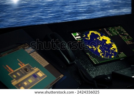 Display of radar, radio, AIS and ECDIS screens in the ship simulator navigation room
