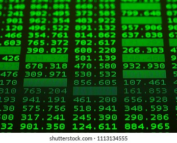 Display of Stock market green quotes on black background, macro