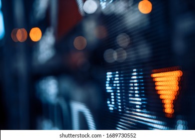 Display stock market numbers with defocused street lights background