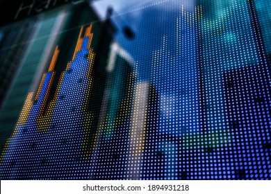 Display Of Stock Market Quotes With City Lights Reflect On Glass, Screen Board On The Street