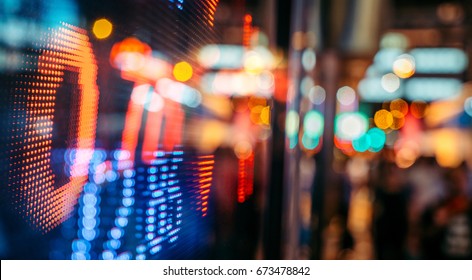 Display of Stock market quotes with city scene reflect on glass - Shutterstock ID 673478842
