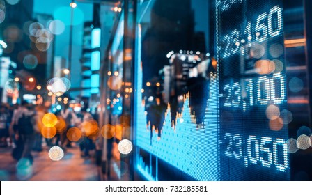 Display of Stock market quotes with city scene reflect on glass - Shutterstock ID 732185581