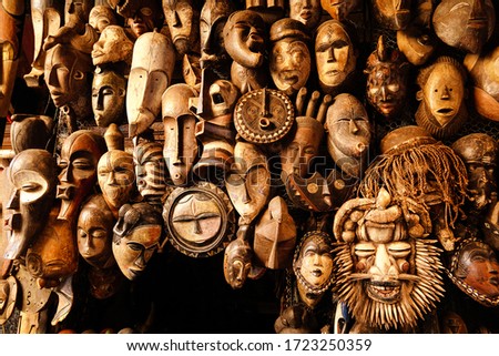 Display of tribal african wooden masks in Marrakech souk in Morocco
