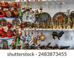 A display of various items including a clock and a camel figurine. The items are arranged on shelves and are colorful