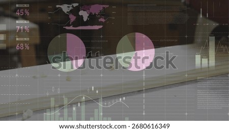 Displaying data overlay highlighting pie bar line charts and map on wooden desk, with notebook. Analytics, data visualization, dashboard, infographics, business intelligence, corporate, digital