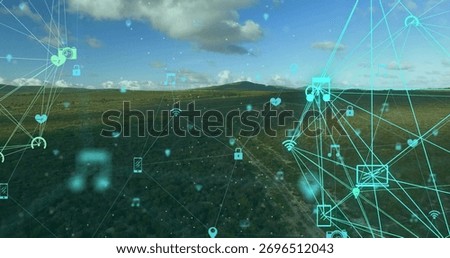 Displaying digital connectivity network overlay covering rural grassland, with glowing cyan icons. Technology, connectivity, communication, innovation, rural landscape, digital, network