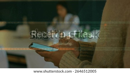 Displaying smartphone progress bar overlay, man in knit sweater working at office desk, copy space. Technology, collaboration, modern, professional, productivity, communication, digital