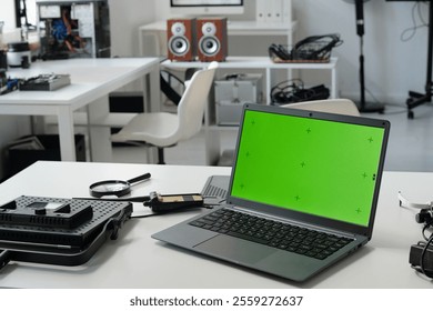 Displaying Technology Equipment with Green Screen Laptop - Powered by Shutterstock