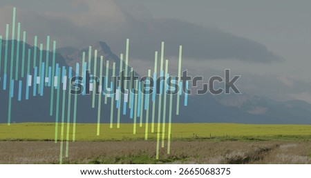 Displaying translucent vertical bars forming chart overlay over rural valley farmland, showing data. Nature, landscape, visualization, abstract, environmental, digital, growth