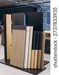 Displaying various material samples for interiors featuring wood, tile, and stone patterns for home renovation and decoration