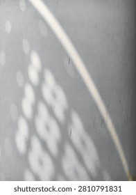 displays abstract shadow patterns produced by sunlight penetrating an object