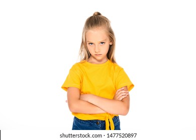 Displeased Child Looking At Camera While Standing With Crossed Arms Isolated On White