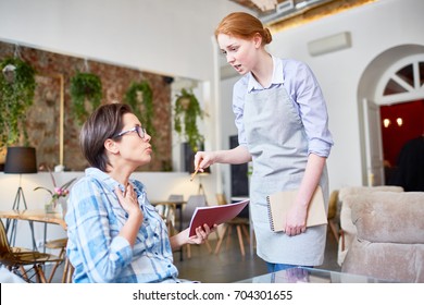 Displeased Client Complaining To Waitress About Bad Food Or Treatment