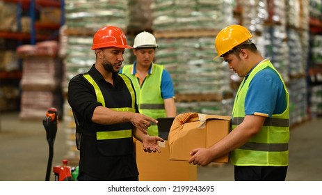 Displeased Male Manager Scolding Young Intern With Bad Work Results, Damaged Cardboard Box. Stress At Work Concept