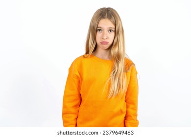Displeased upset beautiful caucasian kid girl frowns face as going to cry, being discontent and unhappy as can't achieve goals,  Disappointed model has troubles - Shutterstock ID 2379649463