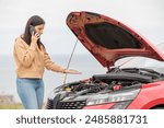 Displeased young adult woman breaks down car in the middle of trip on the road calls tow truck to come repair car, roadside assistance, broken down car tired women