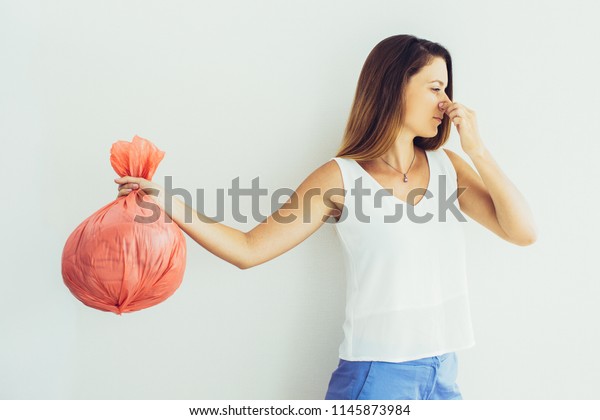 Displeased Young Woman Pinched Face Holding Stock Photo 1145873984