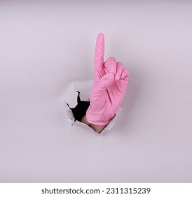 Disposable colored latex gloves. Hand in gloves. Medicine. Sterility. - Shutterstock ID 2311315239