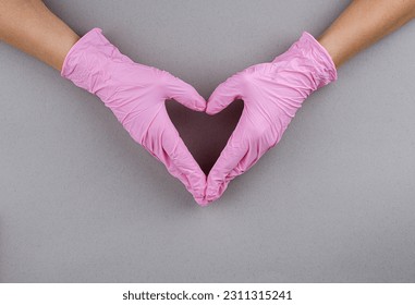Disposable colored latex gloves. Hand in gloves. Medicine. Sterility. - Shutterstock ID 2311315241
