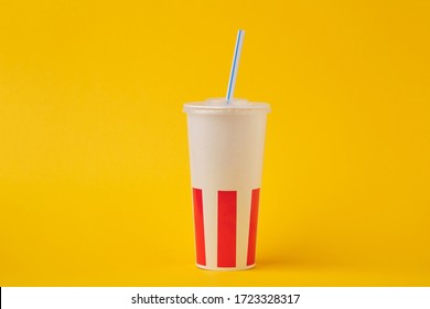 a disposable Cup to drink from fast food on a yellow background